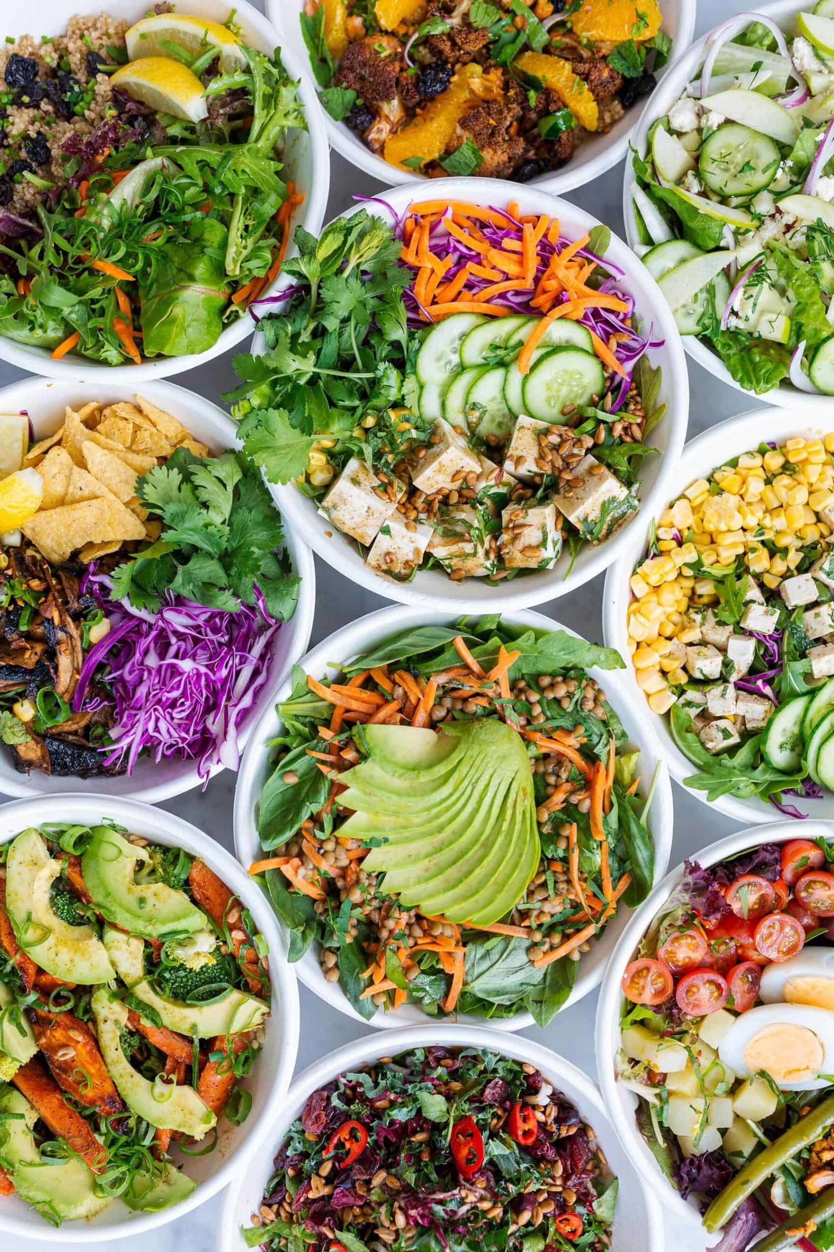 A collection of plates with different dishes served on each one.